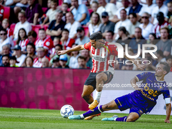 PSV player Couhaib Driouech and Go Ahead Eagles player Mats Deijl during the match PSV vs. Go Ahead Eagles at the Philips Stadium for the Du...