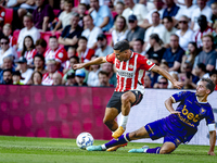 PSV player Couhaib Driouech and Go Ahead Eagles player Mats Deijl during the match PSV vs. Go Ahead Eagles at the Philips Stadium for the Du...