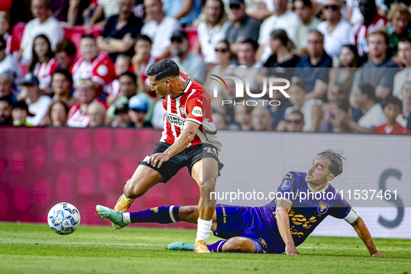 PSV player Couhaib Driouech and Go Ahead Eagles player Mats Deijl during the match PSV vs. Go Ahead Eagles at the Philips Stadium for the Du...