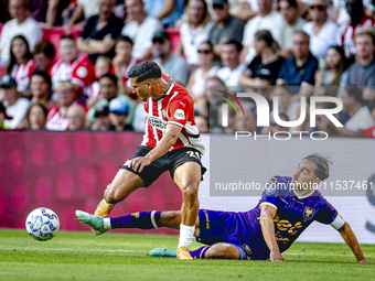 PSV player Couhaib Driouech and Go Ahead Eagles player Mats Deijl during the match PSV vs. Go Ahead Eagles at the Philips Stadium for the Du...