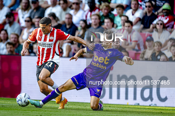 PSV player Couhaib Driouech and Go Ahead Eagles player Mats Deijl during the match PSV vs. Go Ahead Eagles at the Philips Stadium for the Du...