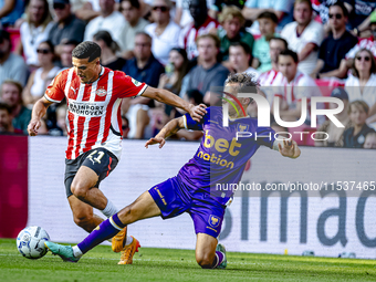 PSV player Couhaib Driouech and Go Ahead Eagles player Mats Deijl during the match PSV vs. Go Ahead Eagles at the Philips Stadium for the Du...