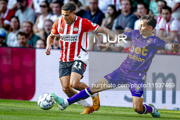 PSV player Couhaib Driouech and Go Ahead Eagles player Mats Deijl during the match PSV vs. Go Ahead Eagles at the Philips Stadium for the Du...