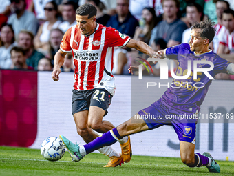 PSV player Couhaib Driouech and Go Ahead Eagles player Mats Deijl during the match PSV vs. Go Ahead Eagles at the Philips Stadium for the Du...