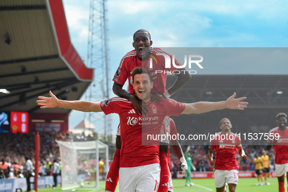 Chris Wood of Nottingham Forest celebrates with Callum Hudson-Odoi of Nottingham Forest after scoring a goal to make it 1-0 during the Premi...