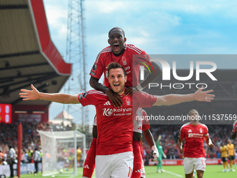 Chris Wood of Nottingham Forest celebrates with Callum Hudson-Odoi of Nottingham Forest after scoring a goal to make it 1-0 during the Premi...