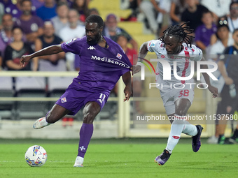 Jonathan Ikone of ACF Fiorentina and Warren Bondo of AC Monza compete for the ball during the Serie A Enilive match between ACF Fiorentina a...