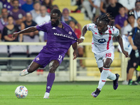 Jonathan Ikone of ACF Fiorentina and Warren Bondo of AC Monza compete for the ball during the Serie A Enilive match between ACF Fiorentina a...