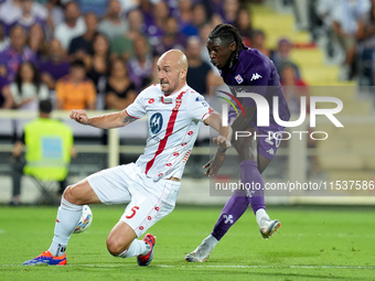 Moise Kean of ACF Fiorentina and Luca Caldirola of AC Monza during the Serie A Enilive match between ACF Fiorentina and AC Monza at Stadio A...