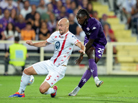 Moise Kean of ACF Fiorentina and Luca Caldirola of AC Monza during the Serie A Enilive match between ACF Fiorentina and AC Monza at Stadio A...