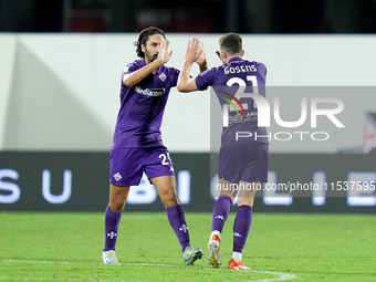 Robin Gosens of ACF Fiorentina celebrates with Yacine Adli after scoring second goal during the Serie A Enilive match between ACF Fiorentina...