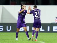 Robin Gosens of ACF Fiorentina celebrates with Yacine Adli after scoring second goal during the Serie A Enilive match between ACF Fiorentina...