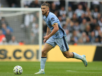 Tottenham Hotspur's Radu Dragusin during the Premier League match between Newcastle United and Tottenham Hotspur at St. James's Park in Newc...