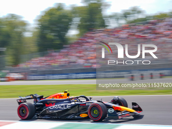 Sergio Perez of Mexico drives the (11) Oracle Red Bull Racing RB20 during the Race of the Formula 1 Pirelli Gran Premio d'Italia 2024 in Mon...