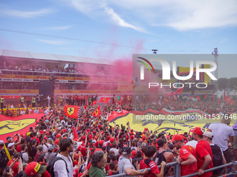 Ferrari fans stand under the podium during the Formula 1 Pirelli Gran Premio d'Italia 2024 in Monza, Italy, on September 1, 2024. (