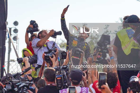 Charles Leclerc takes a selfie with his tifosi during the Race of the Formula 1 Pirelli Gran Premio d'Italia 2024 in Monza, Italy, on Septem...