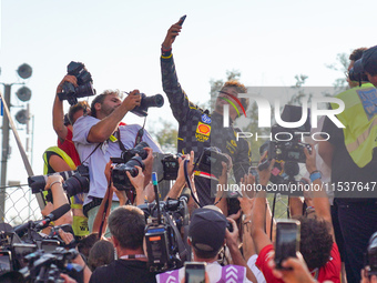 Charles Leclerc takes a selfie with his tifosi during the Race of the Formula 1 Pirelli Gran Premio d'Italia 2024 in Monza, Italy, on Septem...