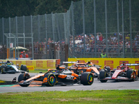 Oscar Piastri of Australia drives the (81) McLaren F1 Team MCL38 and Charles Leclerc of Monaco drives the (16) Scuderia Ferrari SF-24 during...