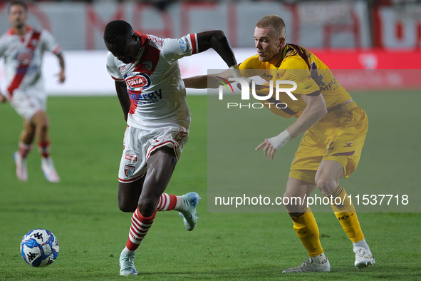 Tijs Velthius of US Salernitana 1919 and Davis Mensah of Mantova 1911 during the Italian Serie B soccer championship football match between...