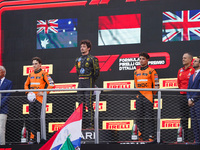 Charles Leclerc, Oscar Piastri, and Lando Norris stand on the podium during the Race of the Formula 1 Pirelli Gran Premio d'Italia 2024 in M...