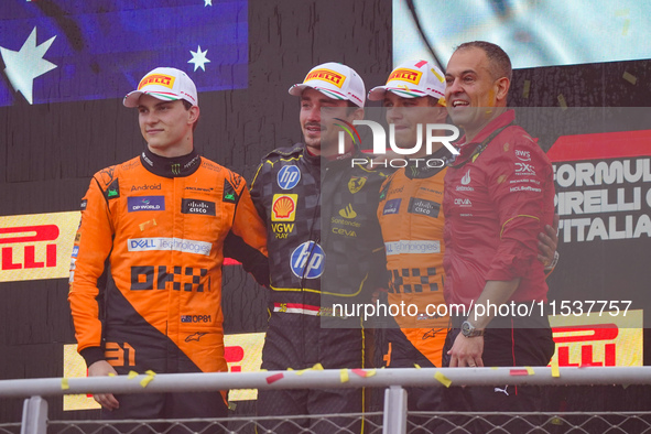 Charles Leclerc, Oscar Piastri, and Lando Norris stand on the podium during the Race of the Formula 1 Pirelli Gran Premio d'Italia 2024 in M...