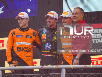 Charles Leclerc, Oscar Piastri, and Lando Norris stand on the podium during the Race of the Formula 1 Pirelli Gran Premio d'Italia 2024 in M...