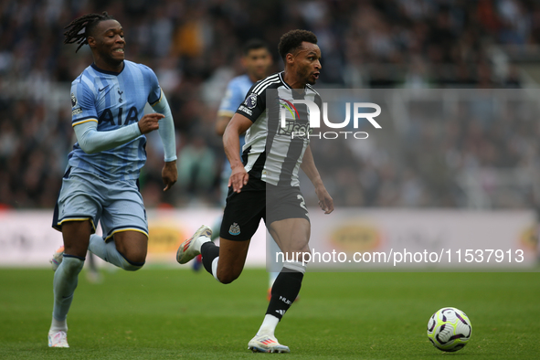 Newcastle United's Jacob Murphy breaks away from Tottenham Hotspur's Destiny Udogie during the Premier League match between Newcastle United...