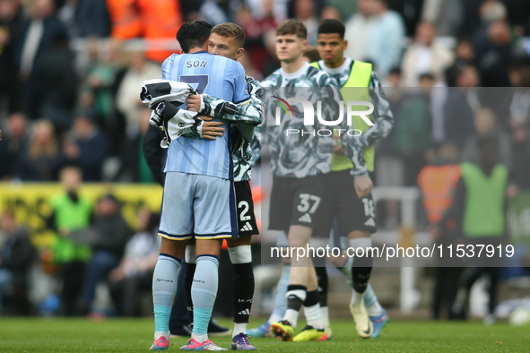 Tottenham Hotspur's Son Heung-Min embraces Newcastle United's Kieran Trippier at full time during the Premier League match between Newcastle...