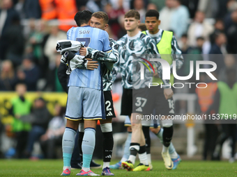 Tottenham Hotspur's Son Heung-Min embraces Newcastle United's Kieran Trippier at full time during the Premier League match between Newcastle...