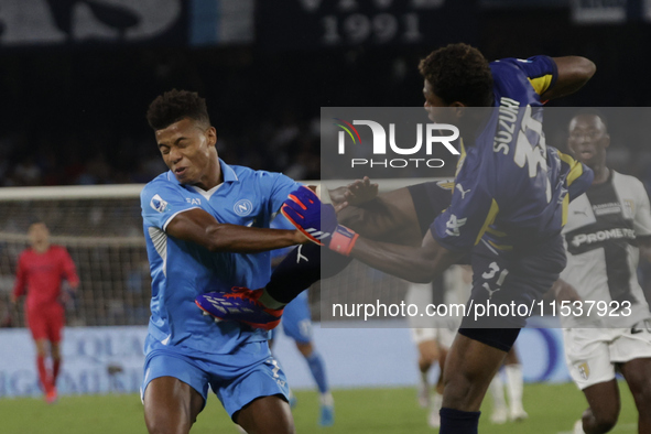 Parma's Zion Suzuki and David Neres of Napoli are seen in action during the Serie A soccer match SSC Napoli - Parma Calcio at Stadio Maradon...