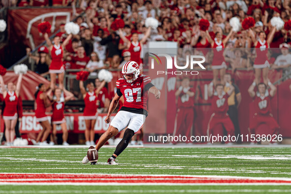 Wisconsin Badgers kicker Gavin Lahm #97 performs the opening kickoff at Camp Randall Stadium in Madison, Wisconsin, on August 30, 2024. 