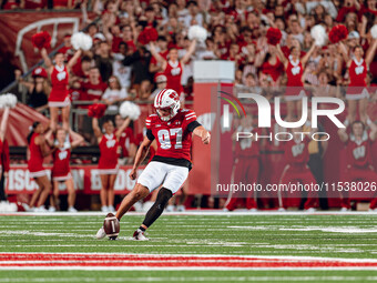 Wisconsin Badgers kicker Gavin Lahm #97 performs the opening kickoff at Camp Randall Stadium in Madison, Wisconsin, on August 30, 2024. (