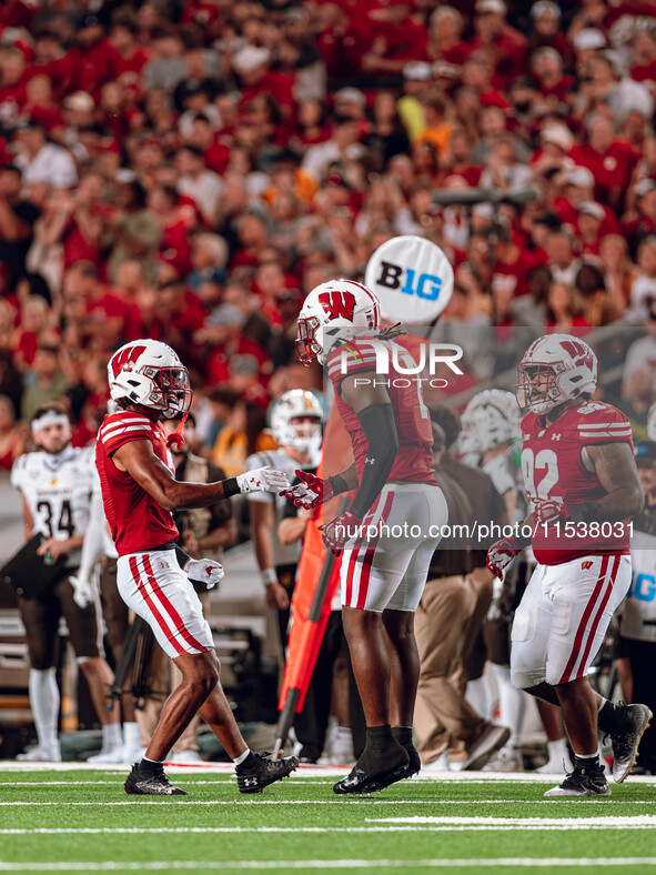 Wisconsin Badgers linebacker Jaheim Thomas #7 celebrates a defensive stop against the Western Michigan Broncos at Camp Randall Stadium in Ma...