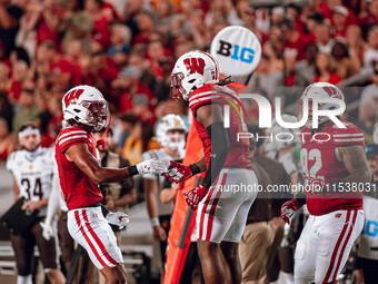 Wisconsin Badgers linebacker Jaheim Thomas #7 celebrates a defensive stop against the Western Michigan Broncos at Camp Randall Stadium in Ma...