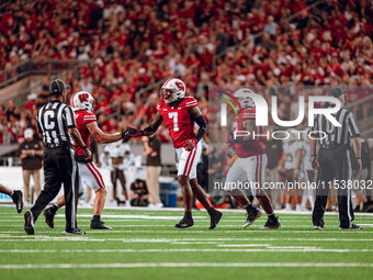 The Wisconsin Badgers defense celebrates a defensive stop against the Western Michigan Broncos at Camp Randall Stadium in Madison, Wisconsin...