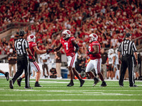 The Wisconsin Badgers defense celebrates a defensive stop against the Western Michigan Broncos at Camp Randall Stadium in Madison, Wisconsin...