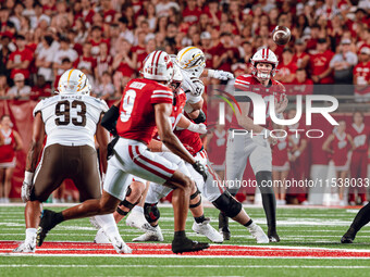 Wisconsin Badgers quarterback Tyler Van Dyke #10 threads a pass to Wisconsin Badgers wide receiver Bryson Green #9 at Camp Randall Stadium i...