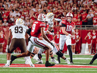 Wisconsin Badgers quarterback Tyler Van Dyke #10 threads a pass to Wisconsin Badgers wide receiver Bryson Green #9 at Camp Randall Stadium i...