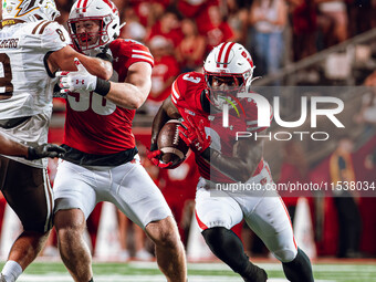 Wisconsin Badgers running back Tawee Walker #3 finds a gap against Western Michigan Broncos at Camp Randall Stadium in Madison, Wisconsin, o...