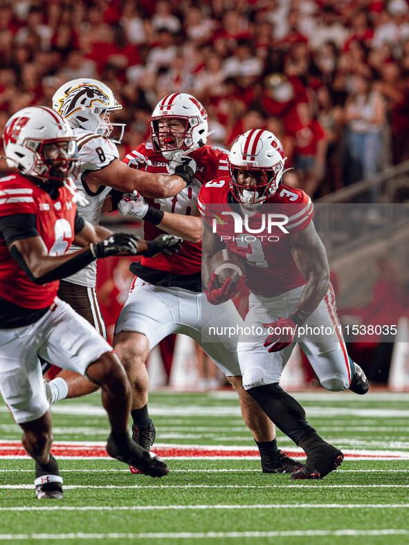 Wisconsin Badgers running back Tawee Walker #3 finds a gap against Western Michigan Broncos at Camp Randall Stadium in Madison, Wisconsin, o...