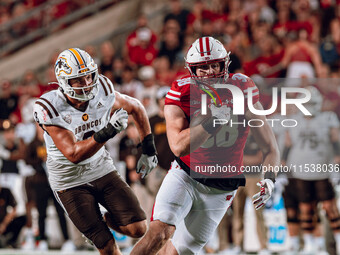 Wisconsin Badgers tight end Tucker Ashcraft #38 runs down the field after a catch against the Western Michigan Broncos at Camp Randall Stadi...