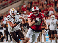 Wisconsin Badgers tight end Tucker Ashcraft #38 runs down the field after a catch against the Western Michigan Broncos at Camp Randall Stadi...