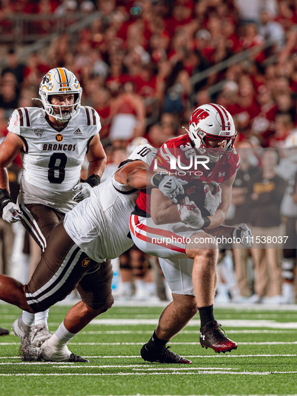 Wisconsin Badgers tight end Tucker Ashcraft #38 runs down the field after a catch against the Western Michigan Broncos at Camp Randall Stadi...