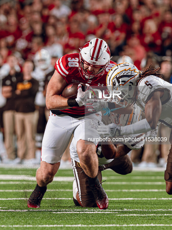 Wisconsin Badgers tight end Tucker Ashcraft #38 runs down the field after a catch against the Western Michigan Broncos at Camp Randall Stadi...