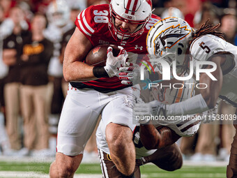 Wisconsin Badgers tight end Tucker Ashcraft #38 runs down the field after a catch against the Western Michigan Broncos at Camp Randall Stadi...