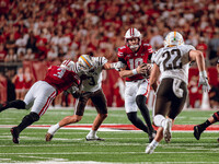 Wisconsin Badgers quarterback Tyler Van Dyke #10 receives help from a Tawee Walker #3 block at Camp Randall Stadium in Madison, Wisconsin, o...