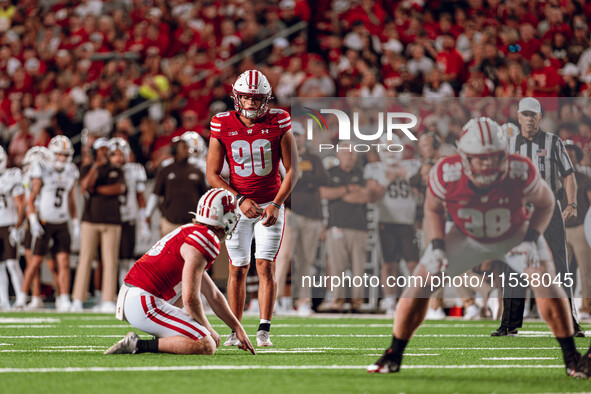 Wisconsin Badgers kicker Nathanial Vakos #90 lines up a kick against Western Michigan Broncos at Camp Randall Stadium in Madison, Wisconsin,...