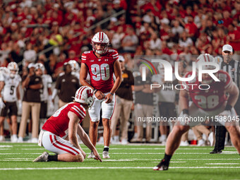 Wisconsin Badgers kicker Nathanial Vakos #90 lines up a kick against Western Michigan Broncos at Camp Randall Stadium in Madison, Wisconsin,...