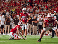 Wisconsin Badgers kicker Nathanial Vakos #90 lines up a kick against Western Michigan Broncos at Camp Randall Stadium in Madison, Wisconsin,...