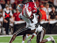 Wisconsin Badgers wide receiver Will Pauling #6 gets tackled by Western Michigan cornerback Bilhal Kone #1 at Camp Randall Stadium in Madiso...